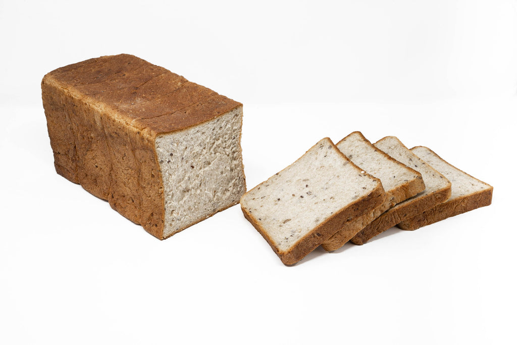 Photo of seeded grain bread loaf sliced