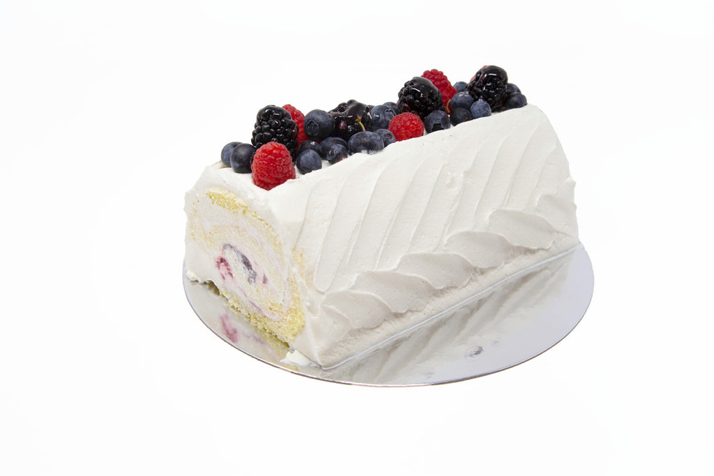 Picture of whole berry berry roll cake with blueberries, raspberries and blackberries